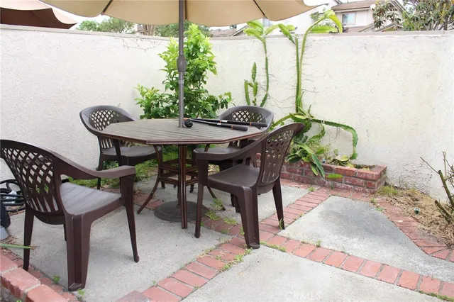 a table and chairs in a patio
