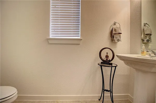 a bathroom with a shower a toilet and a mirror