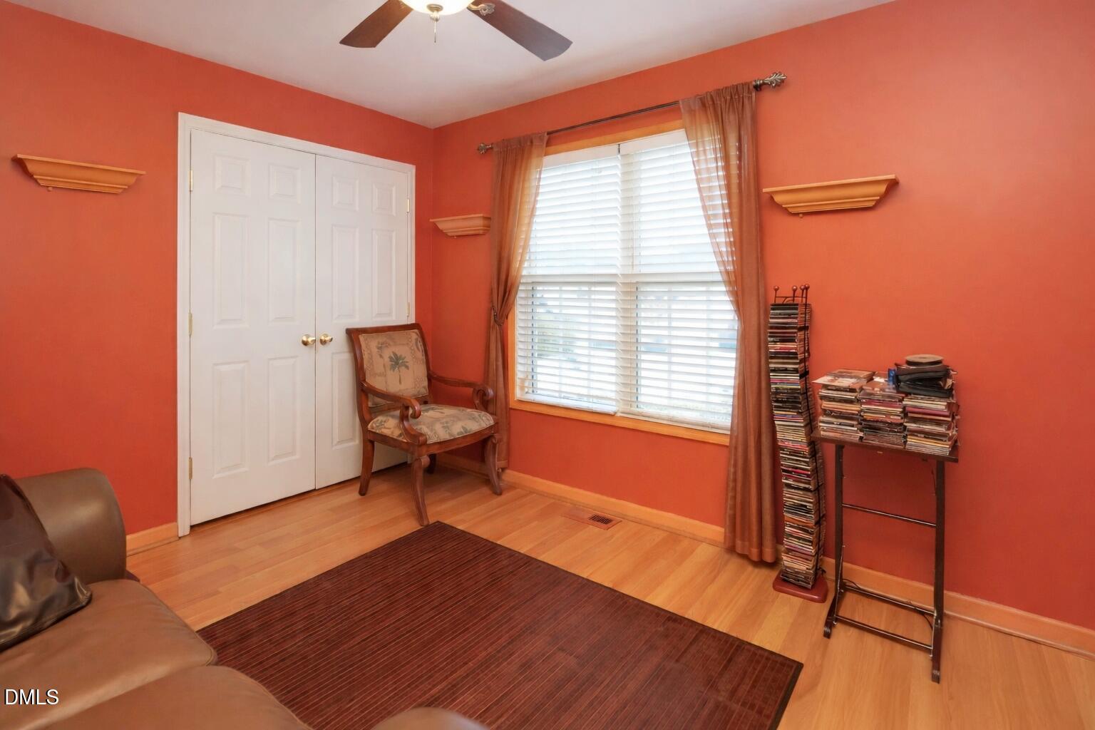 1504 Springshire Court Raleigh, NC 27610 - Photo 13 of 16 a living room with furniture and a window