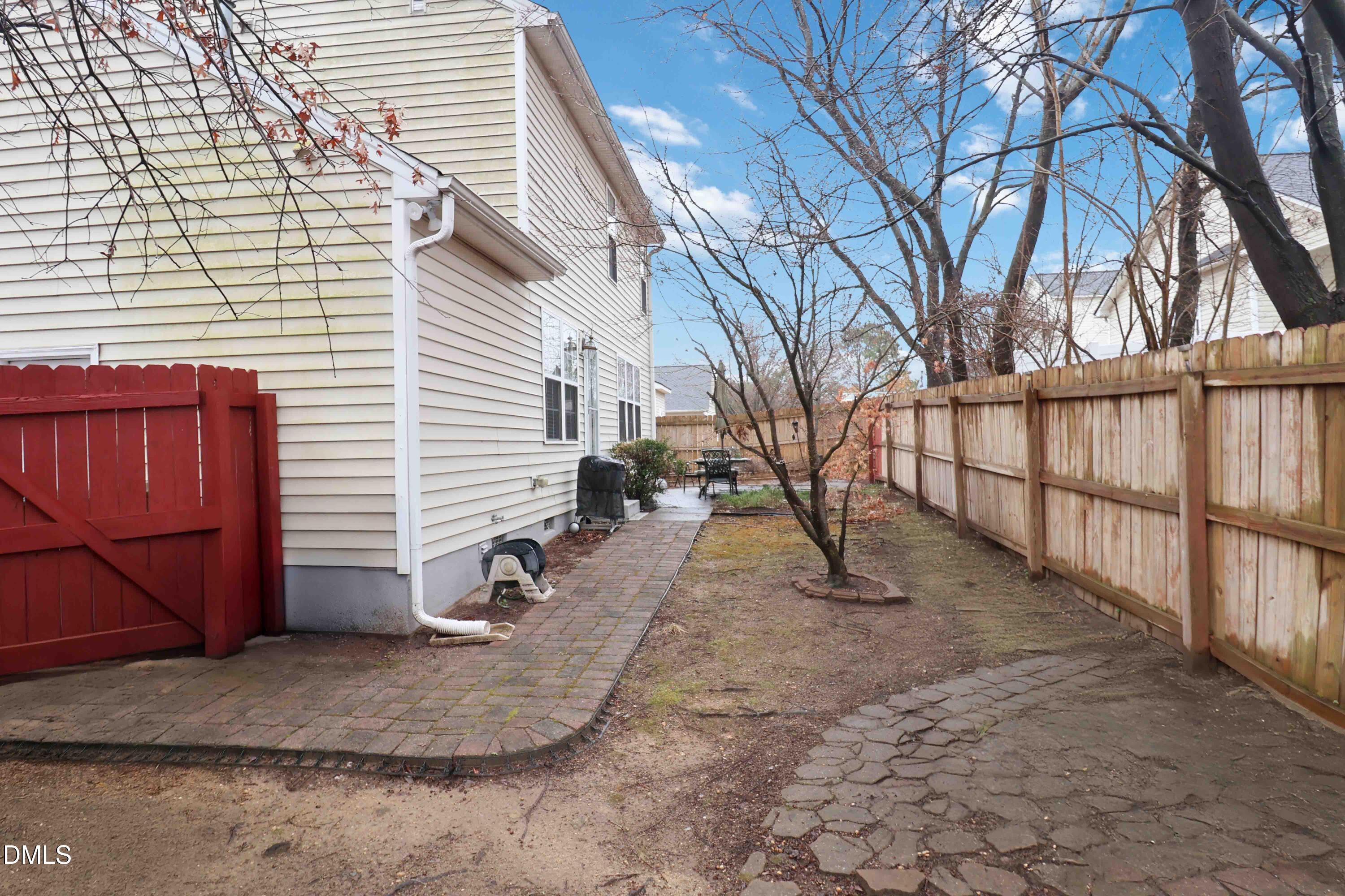 1504 Springshire Court Raleigh, NC 27610 - Photo 14 of 16 a view of a yard with wooden fence