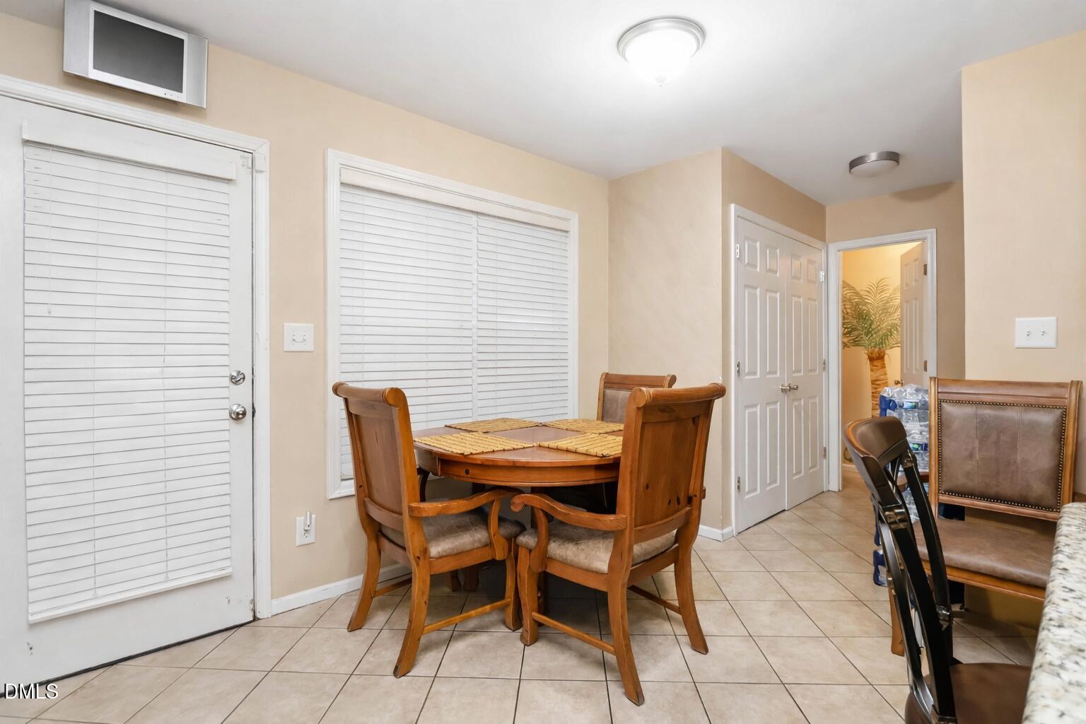 1504 Springshire Court Raleigh, NC 27610 - Photo 5 of 16 a view of a dining room with furniture and a window