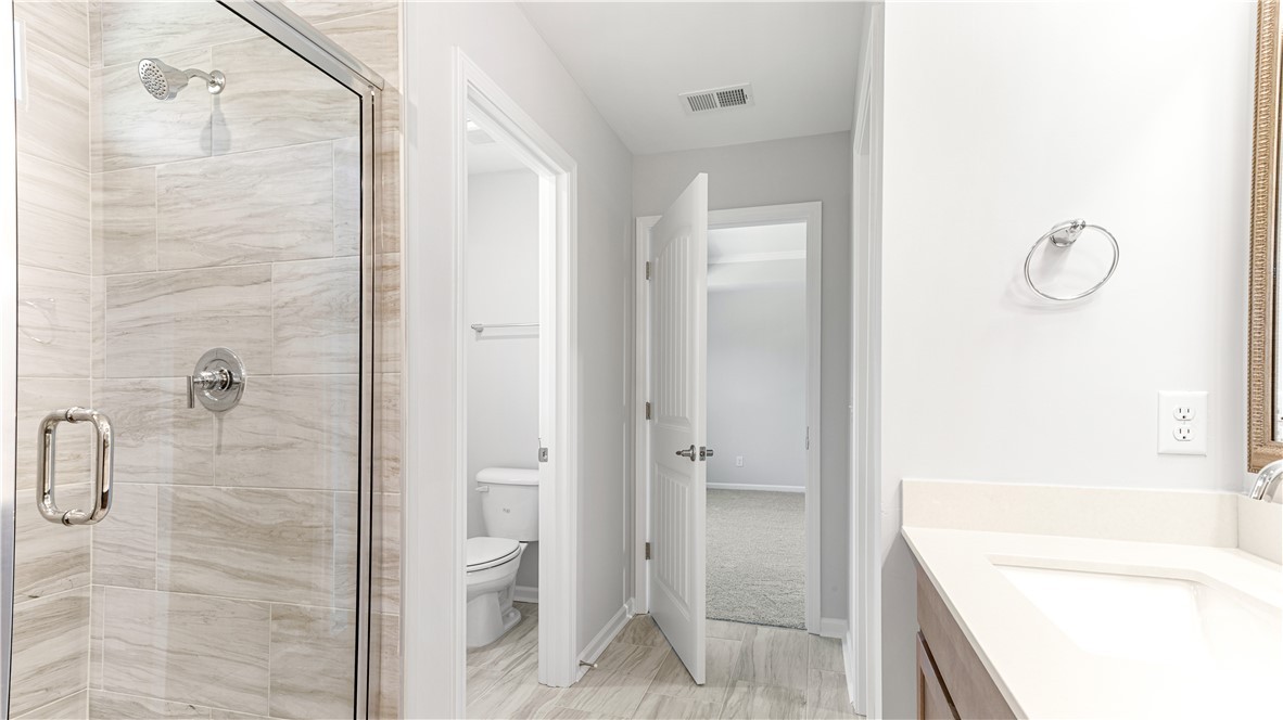 148 Como Drive Pooler, GA 31322 - Photo 28 of 41 Primary bathroom. Gorgeous 6' tiled shower-only with a bench!