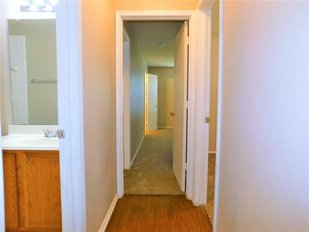2408 Rolling Ridge Drive Little Elm, TX 75068 - Photo 12 of 25 a view of a bathroom from a hallway