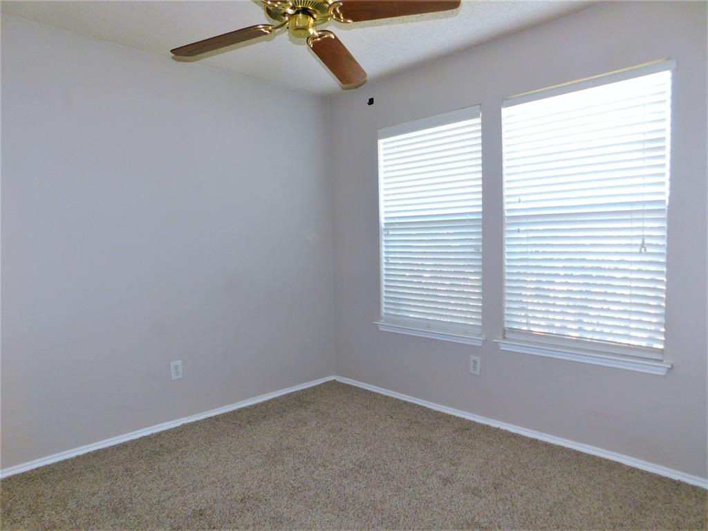 2408 Rolling Ridge Drive Little Elm, TX 75068 - Photo 15 of 25 an empty room with a window