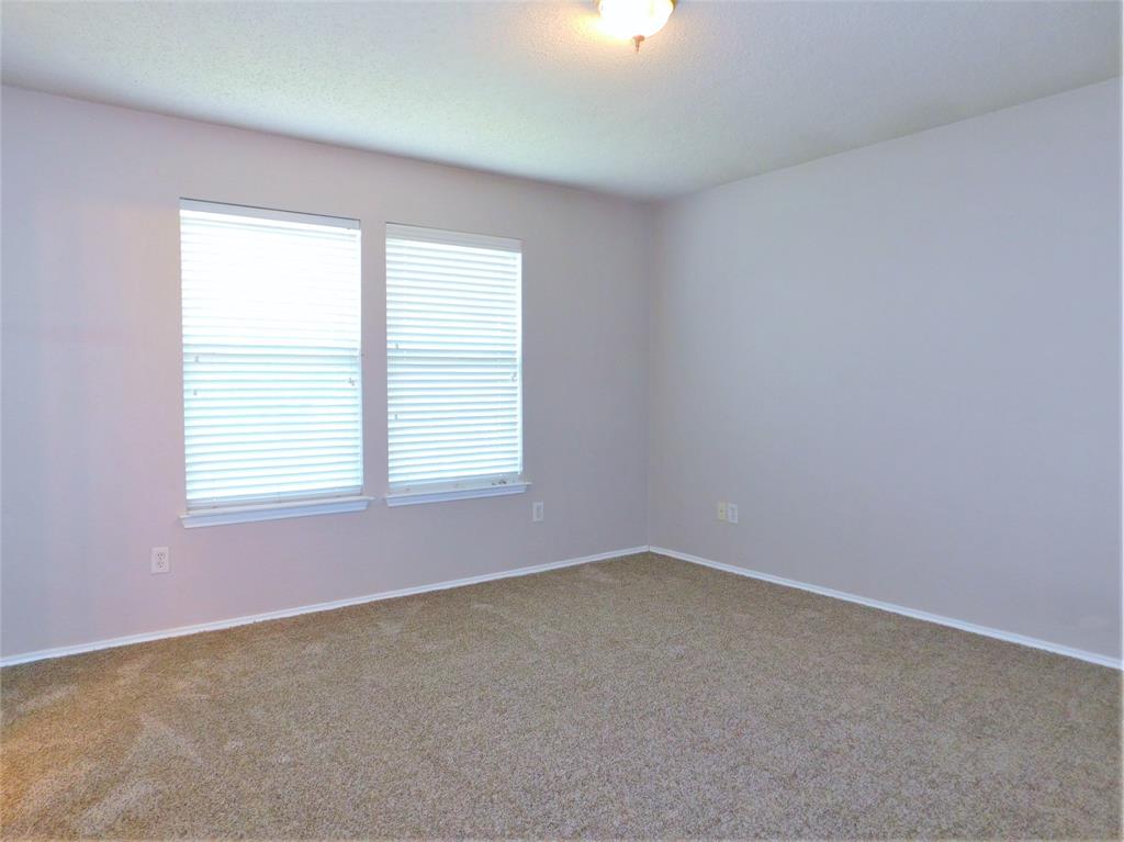 2408 Rolling Ridge Drive Little Elm, TX 75068 - Photo 19 of 25 an empty room with a window