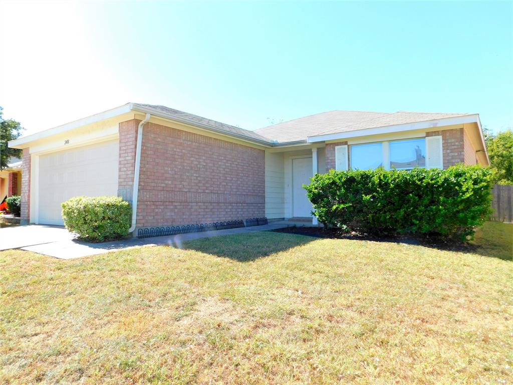 2408 Rolling Ridge Drive Little Elm, TX 75068 - Photo 2 of 25 a view of house with yard and plants