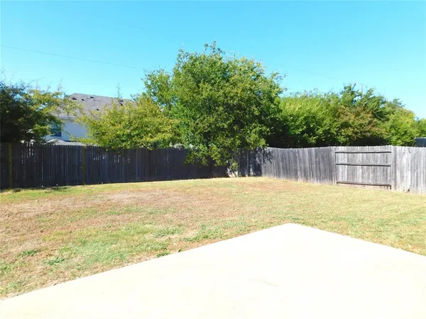 a view of backyard with garage