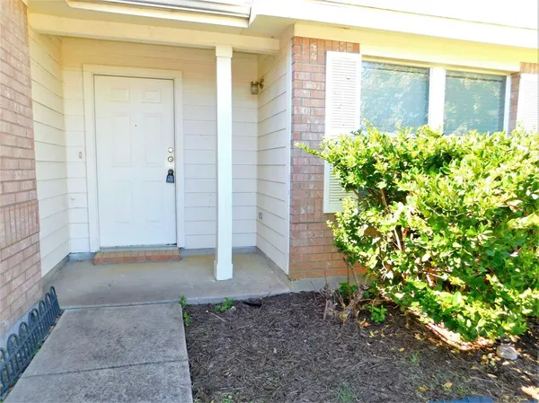 a view of a pathway both side of house