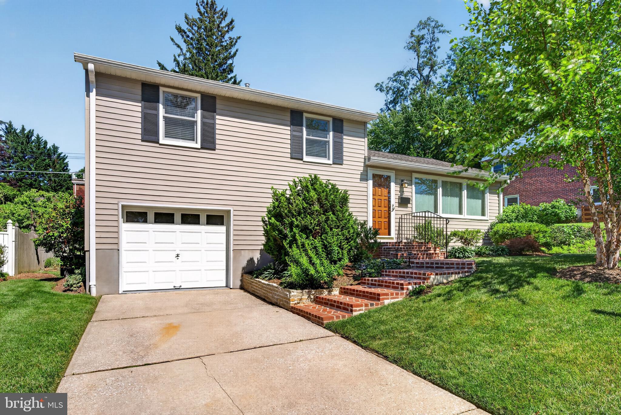 Charming 4-level home with new brick walkway
