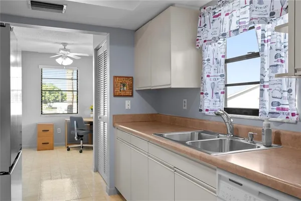 a kitchen that has a sink and a stove
