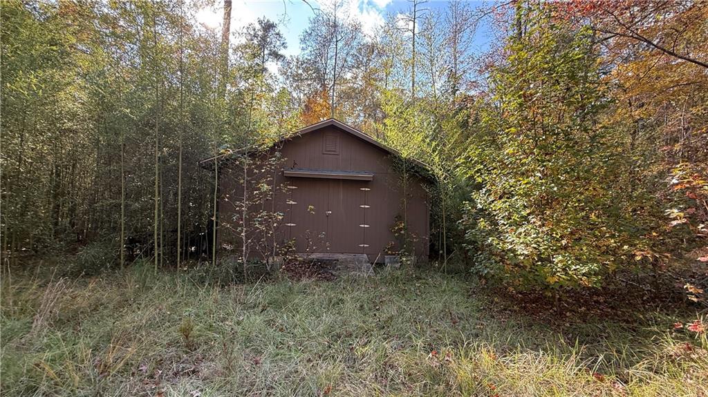 618 South Steel Bridge Road Eatonton, GA 31024 - Photo 20 of 20 a backyard of a house with lots of green space