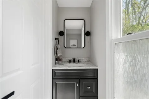 a bathroom with a sink and a mirror