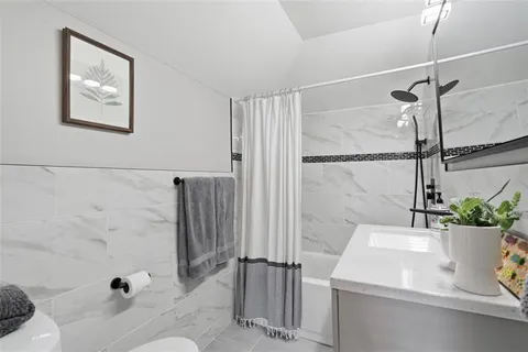 a bathroom with a sink and a shower