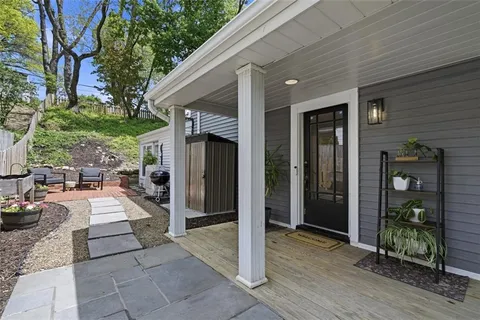 a view of a backyard with sitting area