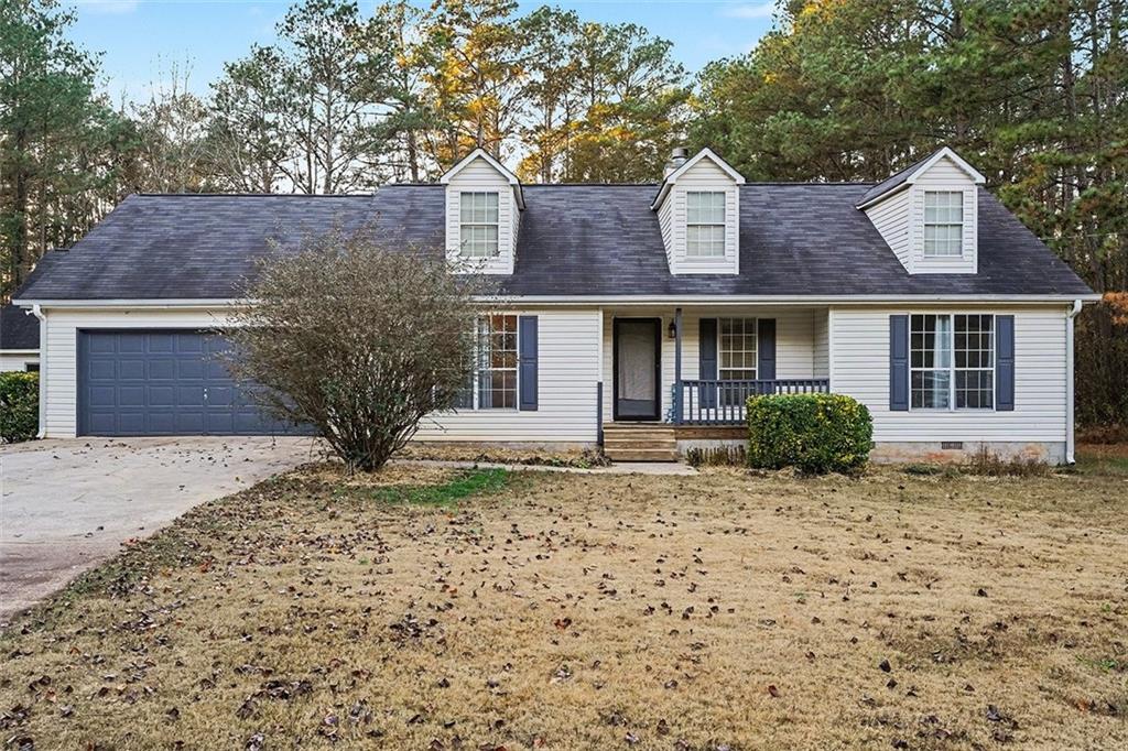 1752 Highway 162 Covington, GA 30016 - Photo 1 of 29 a front view of a house with a yard