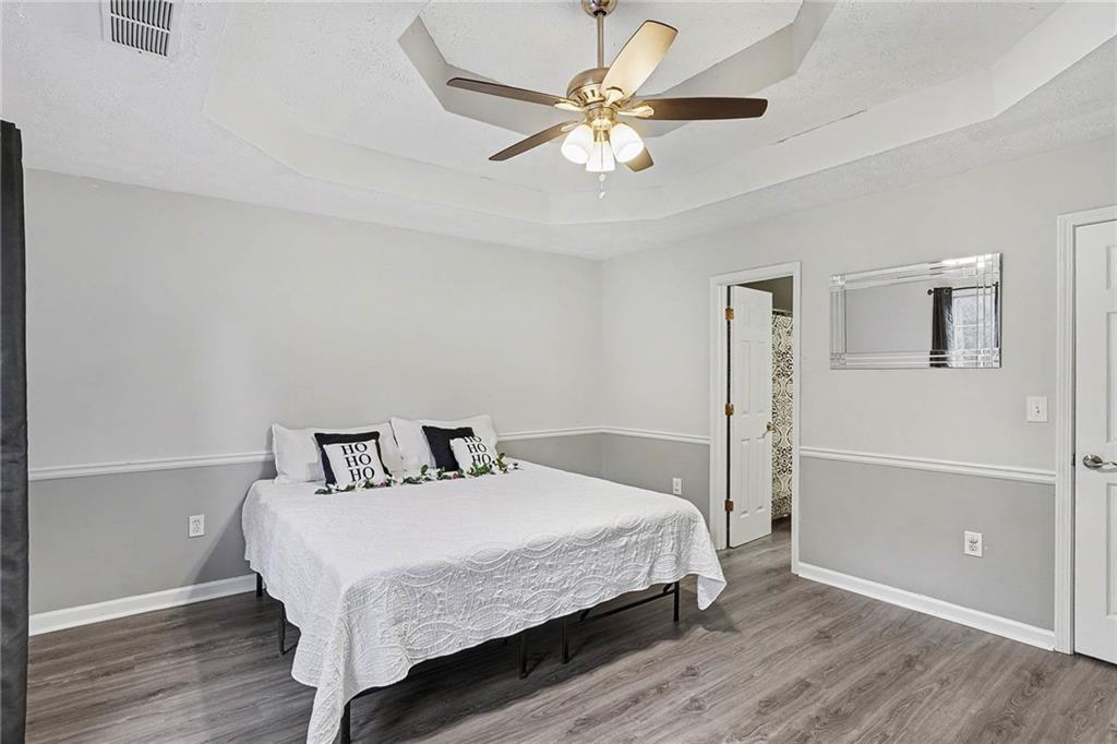 1752 Highway 162 Covington, GA 30016 - Photo 21 of 29 a bedroom with a bed and a ceiling fan