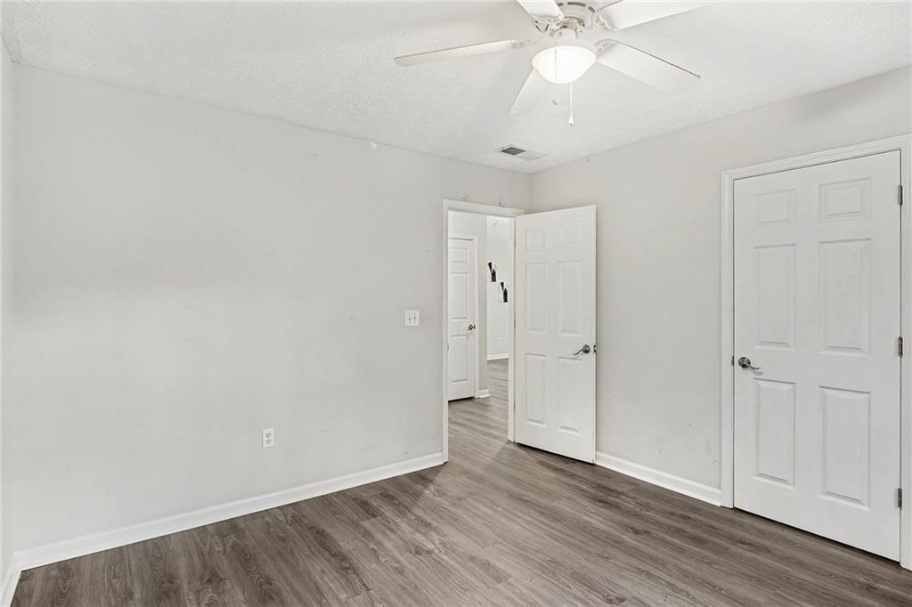 1752 Highway 162 Covington, GA 30016 - Photo 24 of 29 a view of an empty room with wooden floor