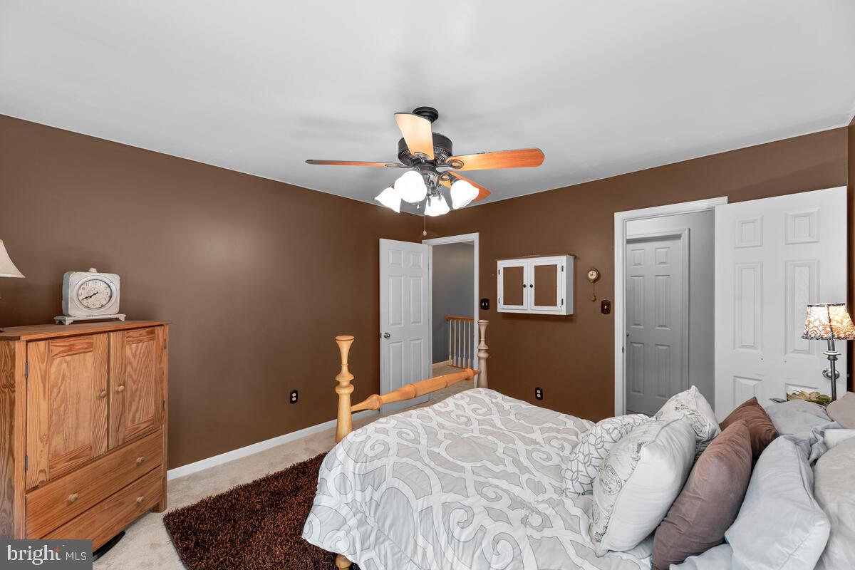 2395 Sunset Farm Road Ellicott City, MD 21042 - Photo 35 of 73 a bedroom with a bed and wooden floor