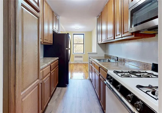 a front view of a building with a garden