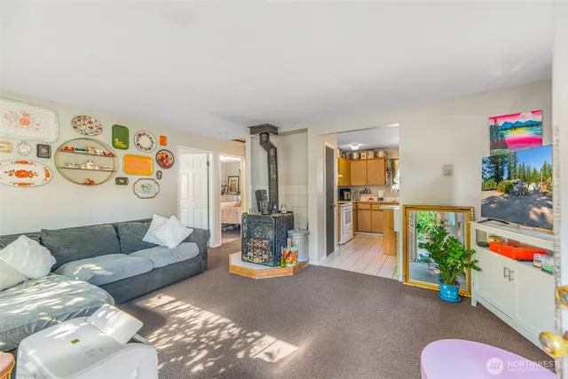 a bedroom with furniture and a large window