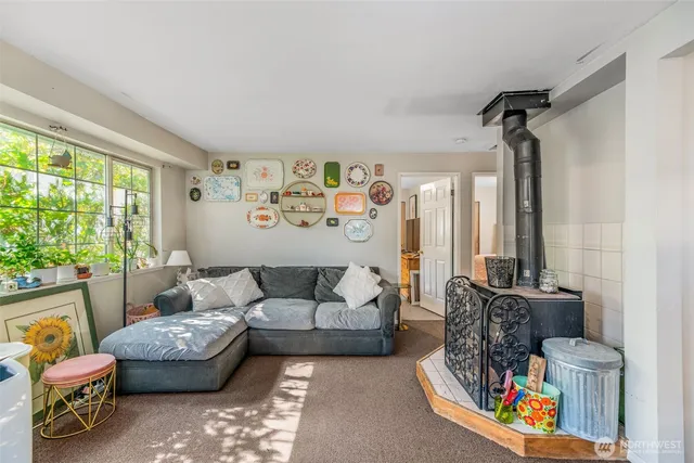 a bed room with furniture and a window