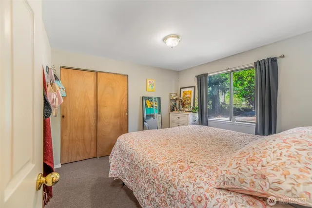 a bathroom with a sink toilet and mirror