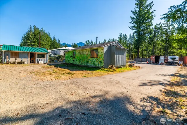 a kitchen with a sink window and cabinets