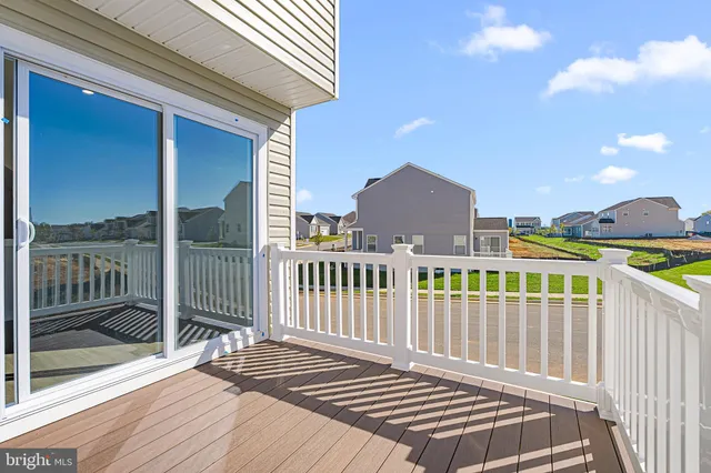 a view of a balcony with wooden floor