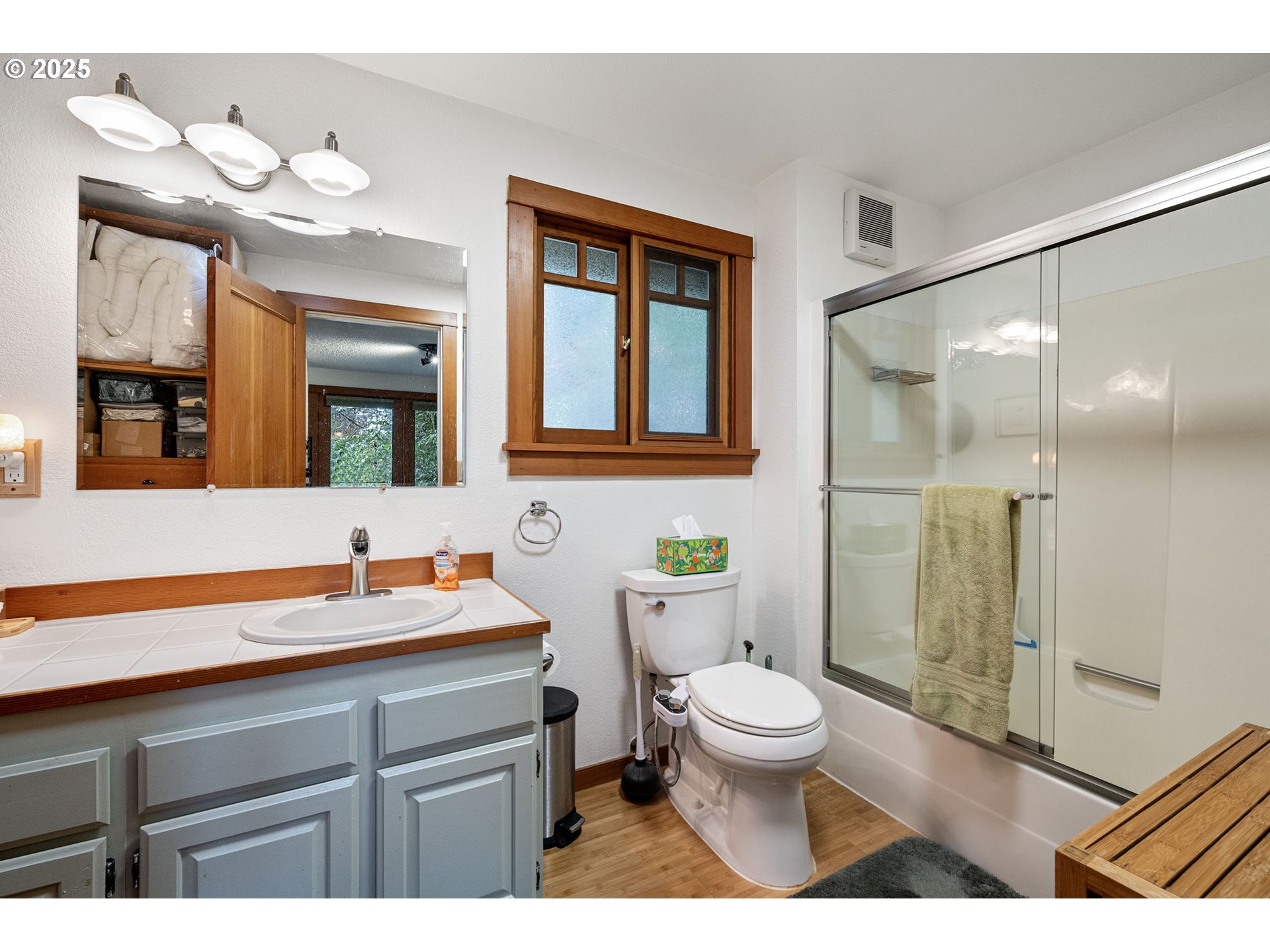 1867 Fircrest Drive Eugene, OR 97403 - Photo 21 of 48 a bathroom with a sink a toilet a large mirror and shower
