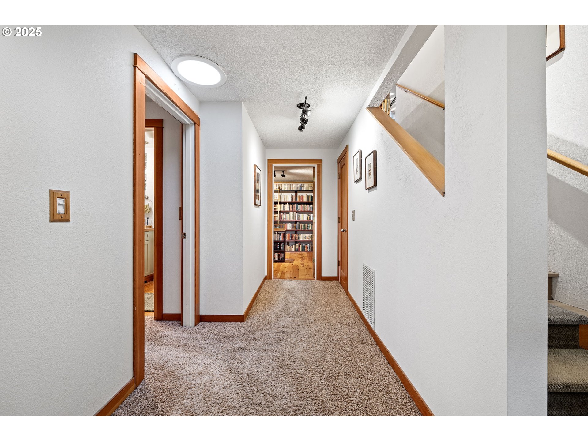 1867 Fircrest Drive Eugene, OR 97403 - Photo 28 of 48 a view of a hallway with wooden floor and entryway