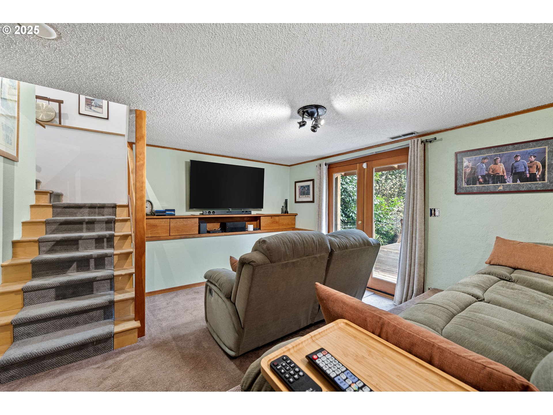 1867 Fircrest Drive Eugene, OR 97403 - Photo 35 of 48 a living room with furniture and a flat screen tv