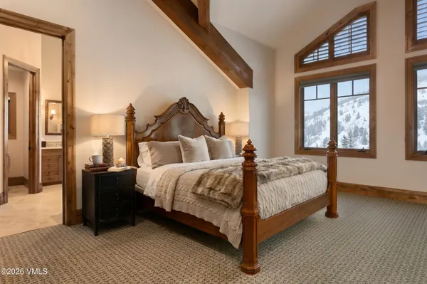 a bathroom with a sink mirror and a bathtub