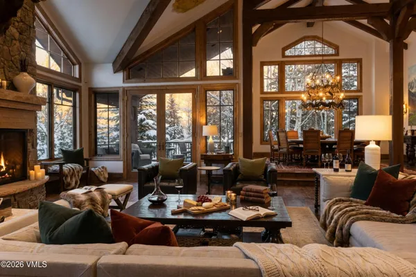 a view of a dining room with furniture wooden floor and chandelier