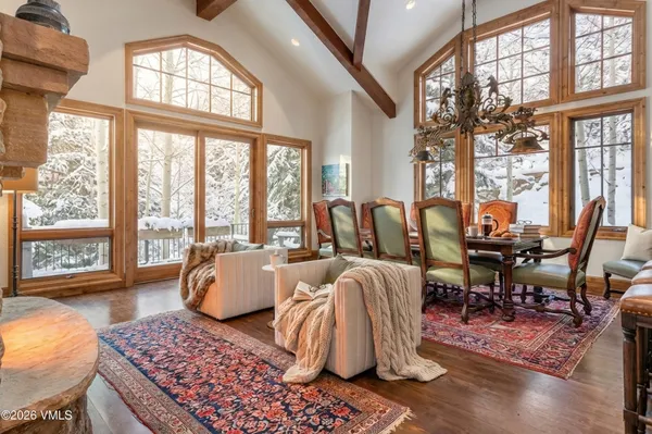 a dining hall with stainless steel appliances a sink and a large window