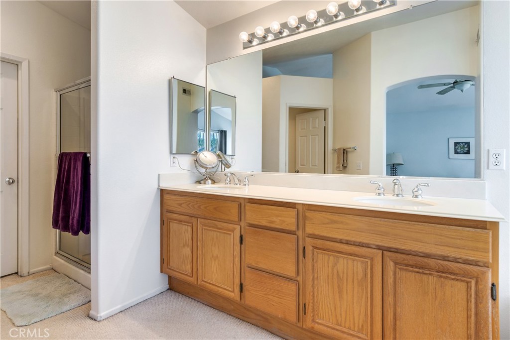 20776 Freeport Drive Riverside, CA 92508 - Photo 4 of 29 a bathroom with a double vanity sink and a mirror