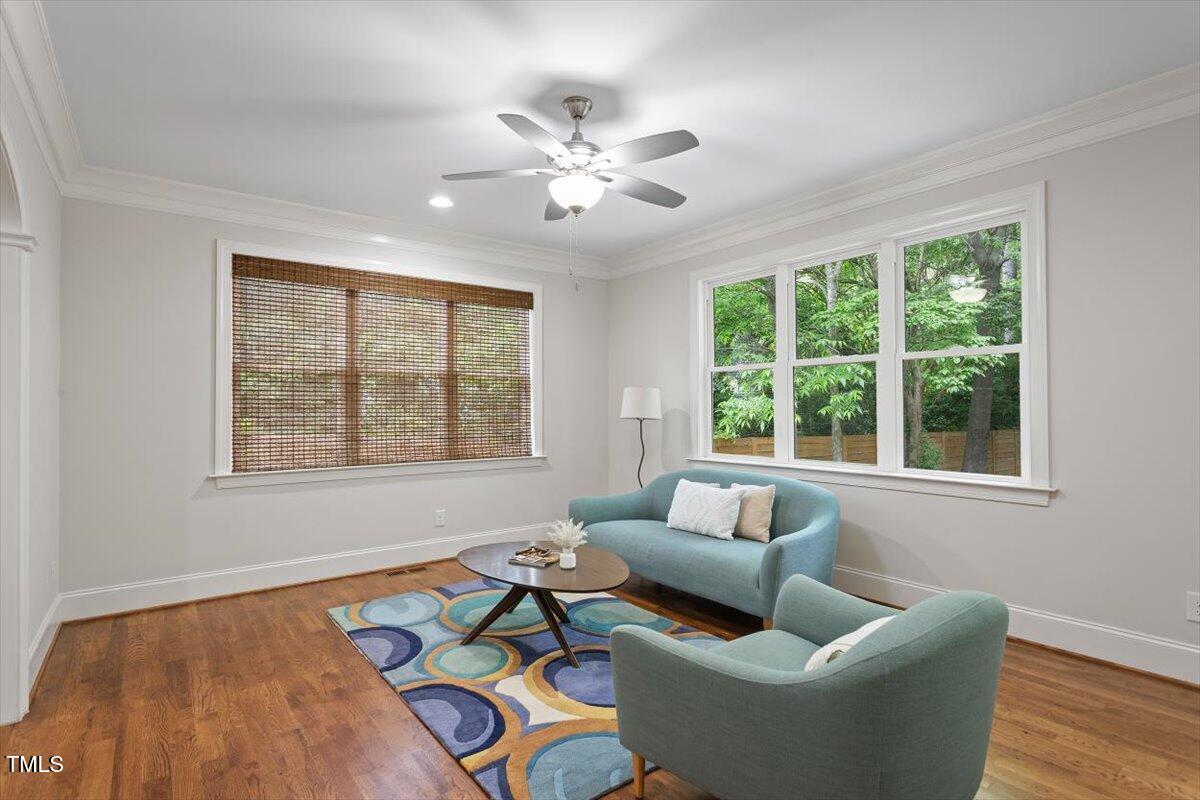 715 Kimbrough Street Raleigh, NC 27608 - Photo 16 of 42 a living room with furniture and a large window