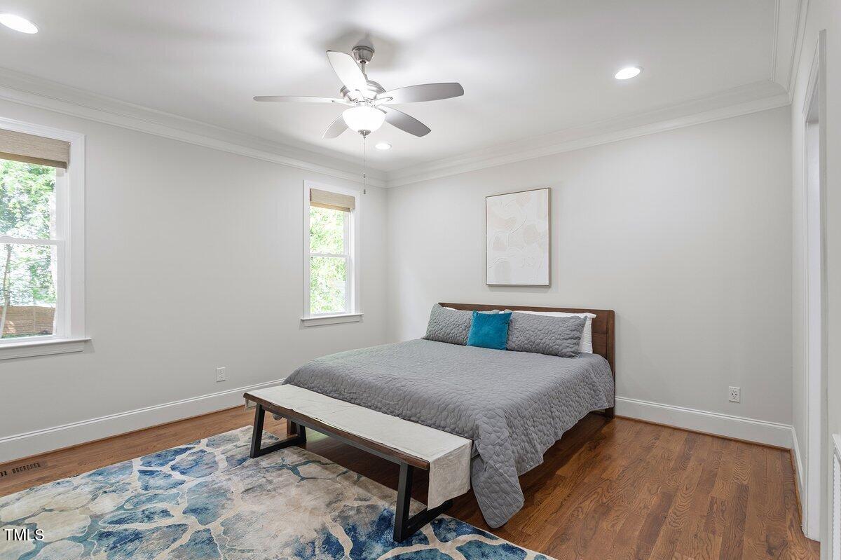 715 Kimbrough Street Raleigh, NC 27608 - Photo 20 of 42 a bedroom with a bed and a window