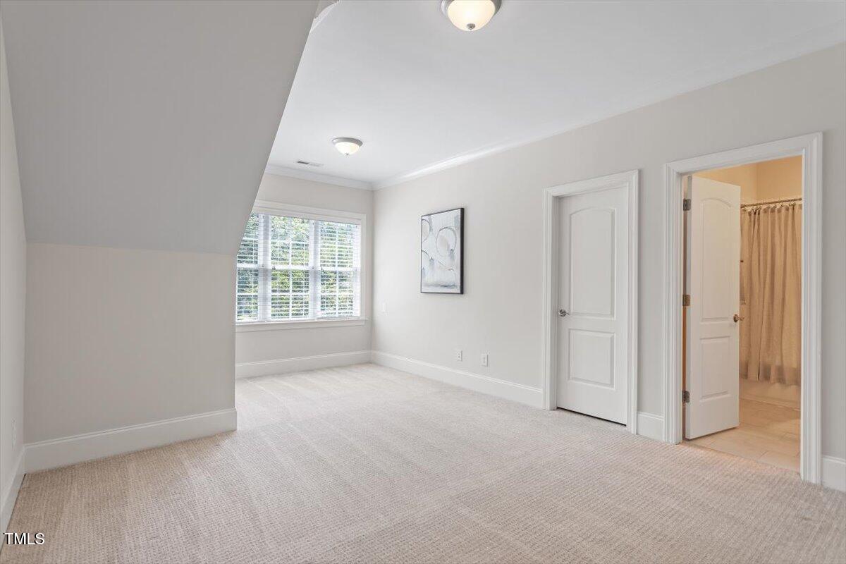 715 Kimbrough Street Raleigh, NC 27608 - Photo 26 of 42 an empty room with windows and closet