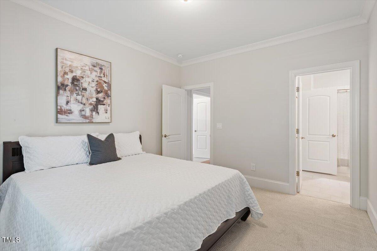 715 Kimbrough Street Raleigh, NC 27608 - Photo 31 of 42 a bedroom with a bed and painting on the wall