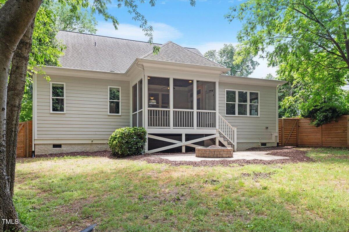 715 Kimbrough Street Raleigh, NC 27608 - Photo 40 of 42 a view of backyard with a chair and table in the house