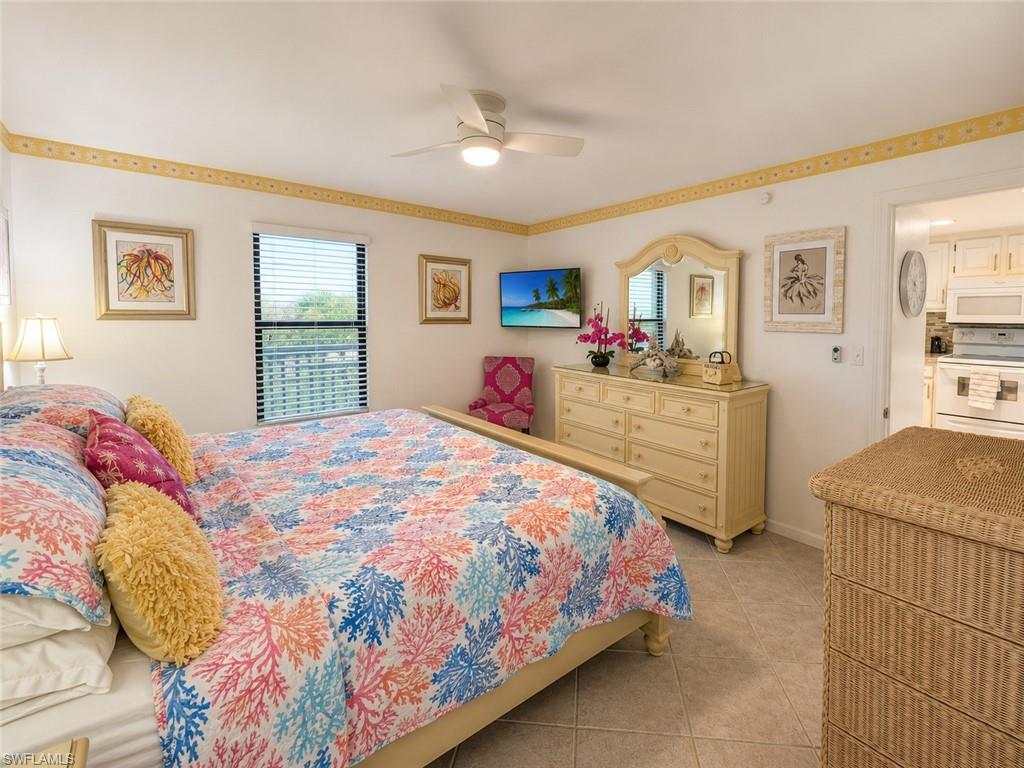 600 Neapolitan Way, Unit 449 Naples, FL 34103 - Photo 14 of 44 Interior room featuring neutral wall paint with decorative trim