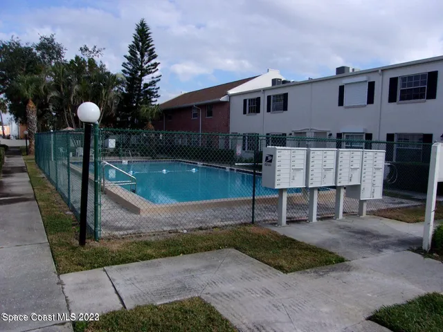 a view of backyard with outdoor seating and entertaining space