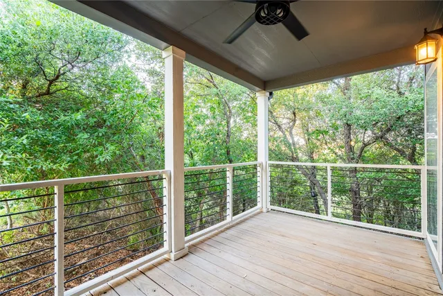 a view of a balcony with wooden floor