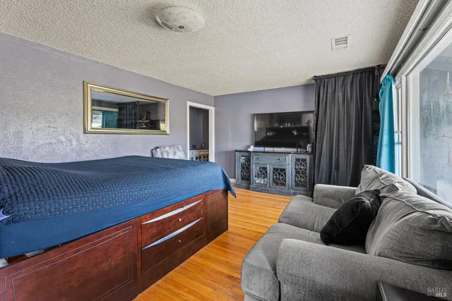 a bedroom with a bed and furniture