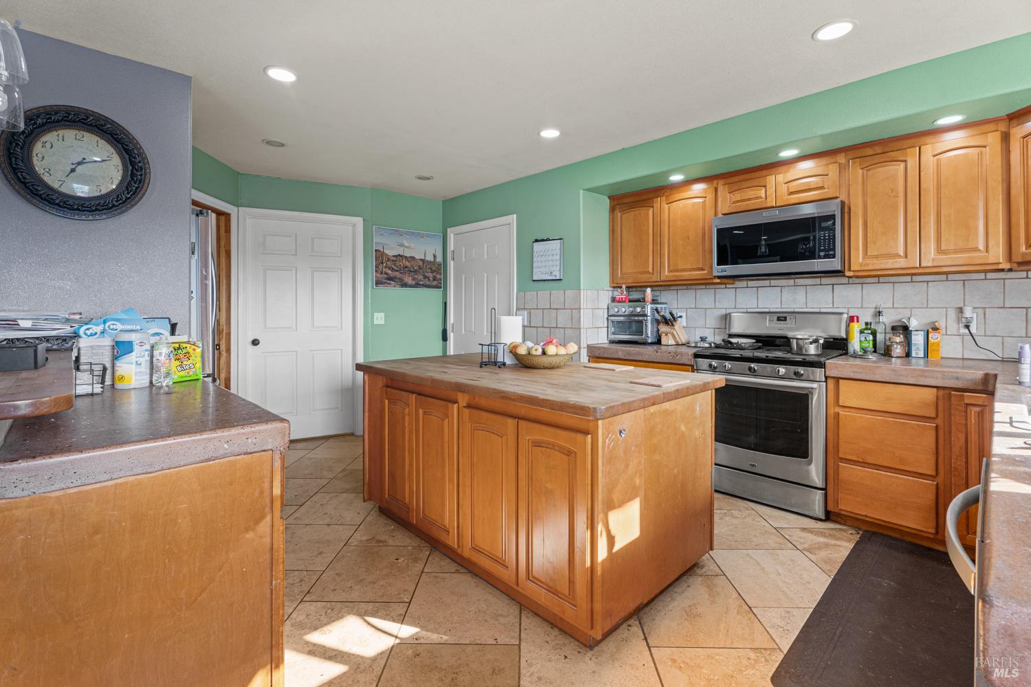 3700 Ruddick Cunningham Road Ukiah, CA 95482 - Photo 22 of 27 a kitchen with stainless steel appliances granite countertop a stove a sink and a microwave