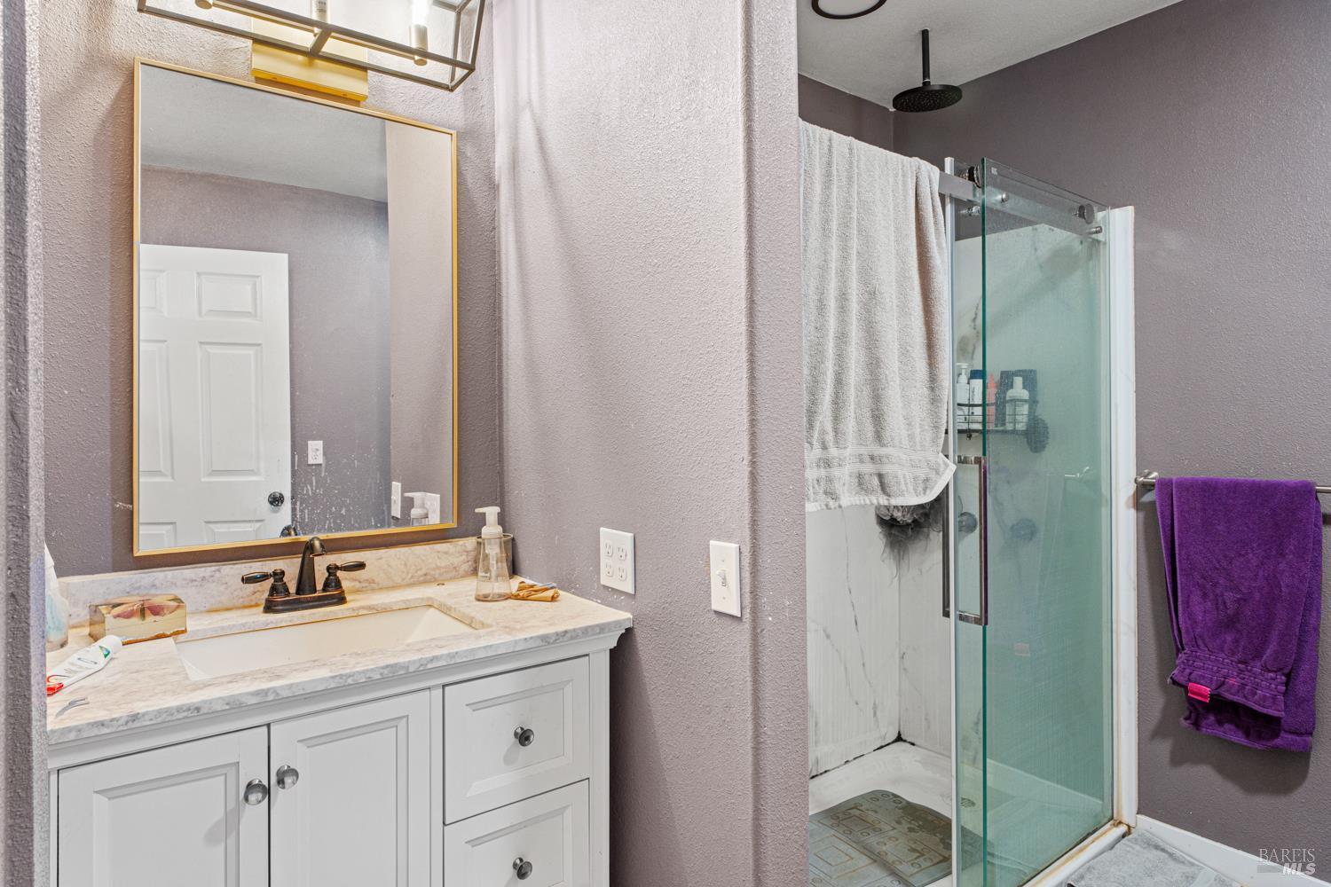 3700 Ruddick Cunningham Road Ukiah, CA 95482 - Photo 24 of 27 a bathroom with a shower sink and mirror
