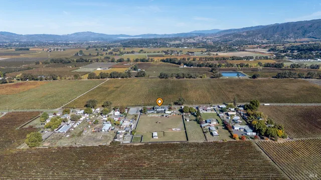 an aerial view of a house with a lake view