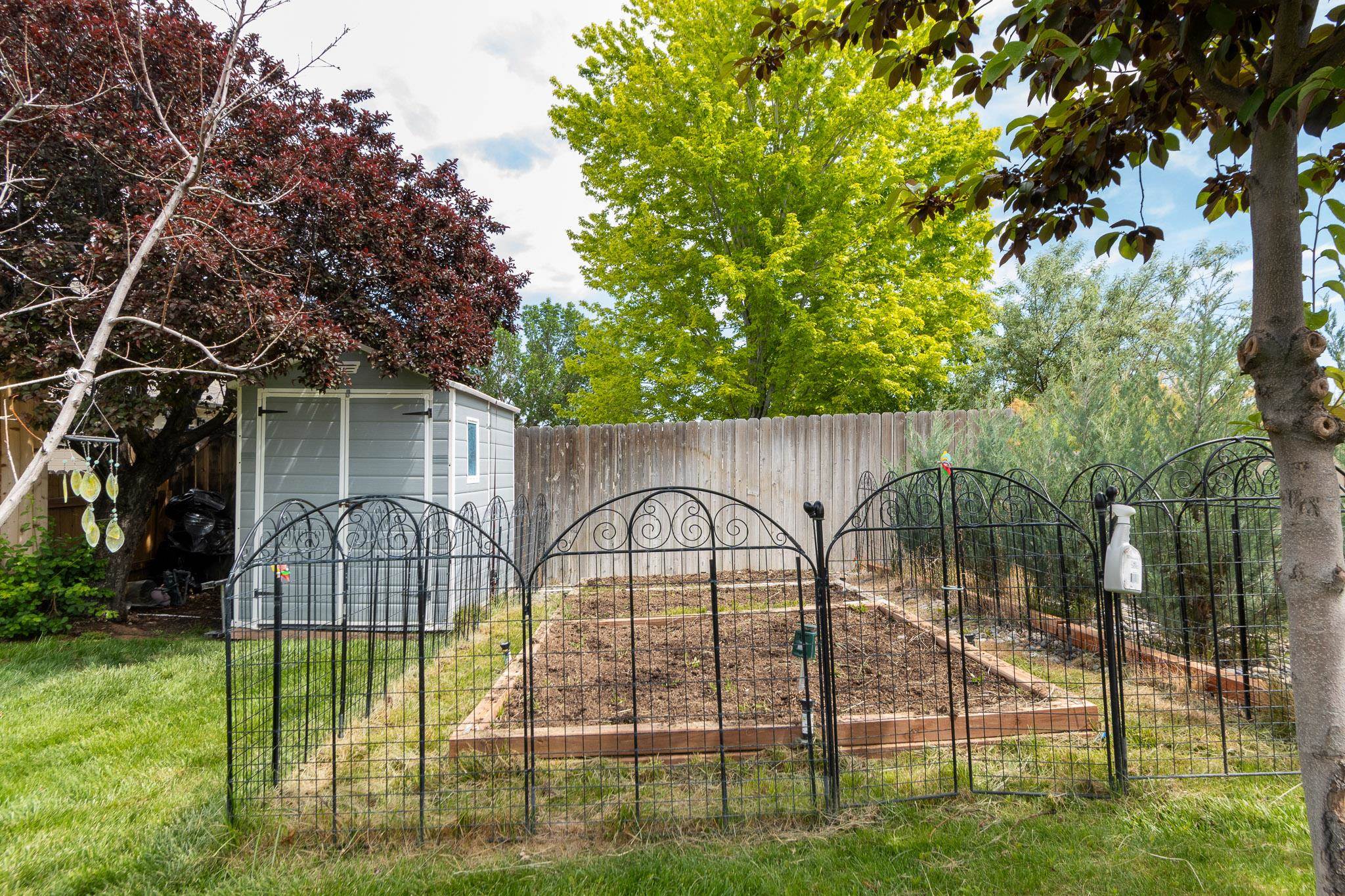 398 Butte Court Grand Junction, CO 81507 - Photo 28 of 33 a view of backyard with swimming pool and outdoor seating