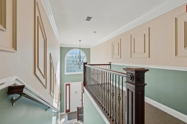a view of a hallway with staircase