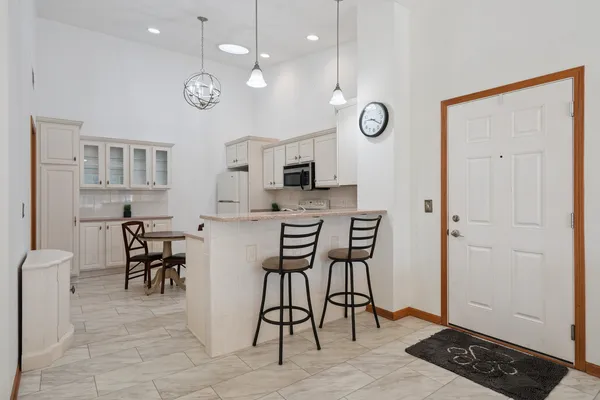a view of kitchen with cabinets and wooden floor